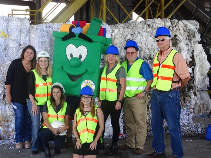 PAPER TRAIL — GEL Recycling Director of Sales Jacqueline Kerr leads DeLand Breakfast Rotarians, City of DeLand employees, Beacon staffers and DeLand’s “Clean Green” mascot, Skip D. Landfill, on a tour of the Orange City plant in 2018. BEACON PHOTO/ERIKA WEBB