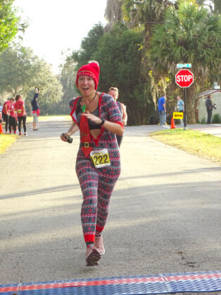 <p><p><strong>ALL DRESSED UP </strong>— An enthusiastic Maria Pecoraro-McCorkle runs the course. The race website lists her as finishing in 233rd place.</p></p><p>BEACON PHOTO/MARSHA MCLAUGHLIN</p>