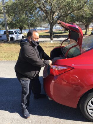 <p><p>A LOAD OF LOVE — Pete Ayala, of Serve All Catering, packs boxes and bags into the vehicle of a driver who has waited patiently for them.</p></p><p></p>