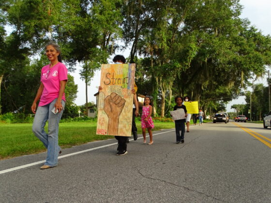 <p><p>Lake Helen Mayor Daisy Raisler, in front, marches with Lake Helenites to city
                    hall June 26.</p>
                </p><p></p>