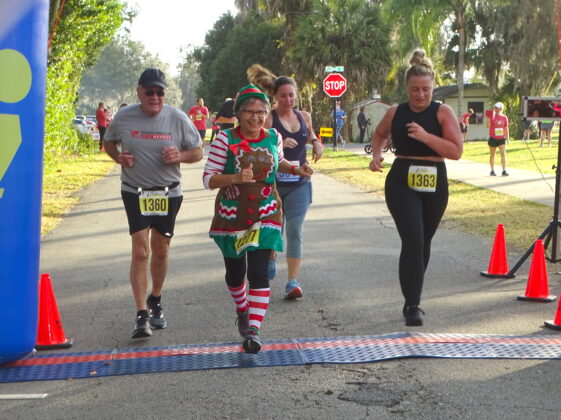 <p><p><strong>THE FINISH LINE </strong>— From left, Malcolm Johnson, Marieann Bannan and Rachel Johnson cross the finish lines in the Lake Helen Holiday Stress Buster 5K on Christmas Eve. The three finished in 258th, 254th and 259th place, respectively, according to results published on the official race website. </p></p><p>BEACON PHOTO/MARSHA MCLAUGHLIN</p>