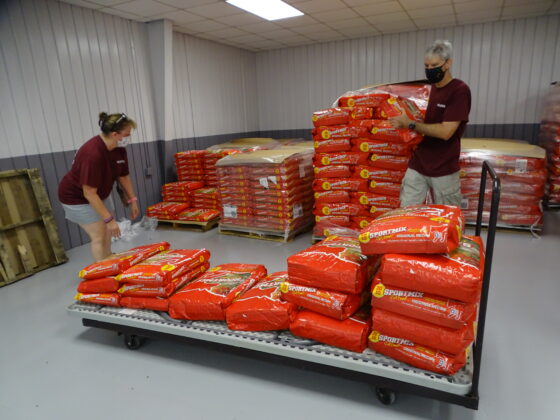<p><p>A small sampling of the hundreds of pounds of pet food given away to owners at the event. Pictured here, volunteers Renee Schoen and Mark Peterka.</p></p><p></p>