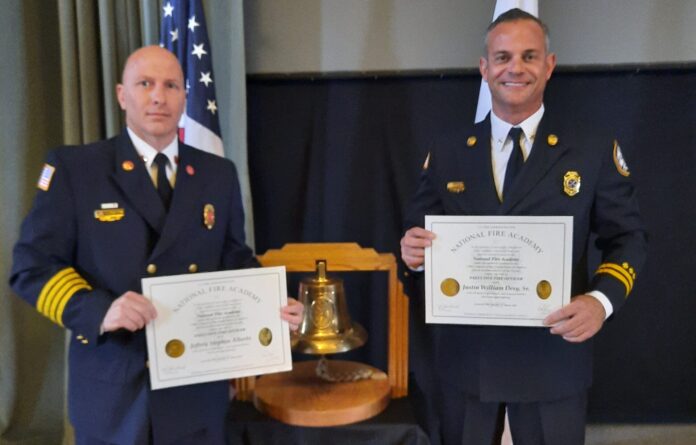 two firefighter graduates